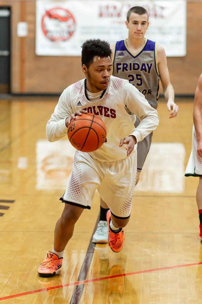 Jocobi Pilgrim looks for an opening in the Friday Harbor defense.(Photo by John Fisken)