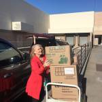 Photo provided .                                <em>Linda French was the clothing representative who first contacted Nunn with Dove Detches idea to open up a free-of-charge boutique collection for donation. Here, she helps load boxes of clothes that will be given away.</em>