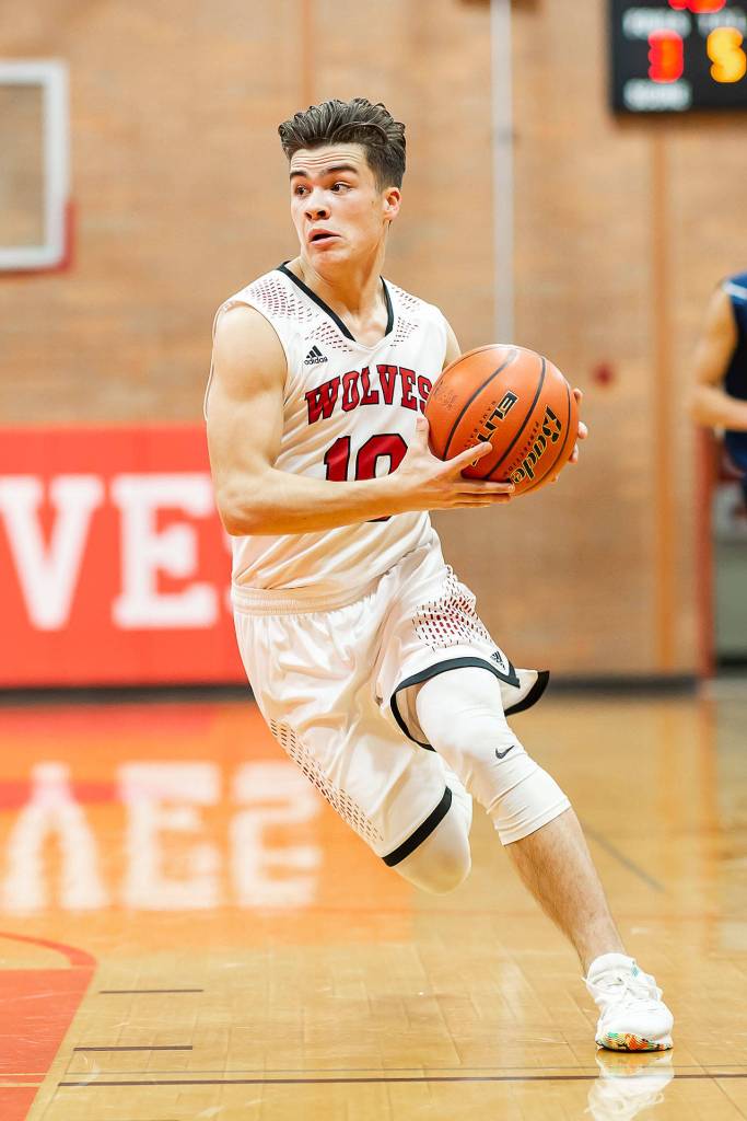 Sean Toomey-Stout attacks the basket in the Sultan game.(Photo by John Fisken)