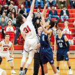 Coupevilles Ulrik Wells, left, wins the opening tip against Sultans Cameron Gunderson.(Photo by John Fisken)