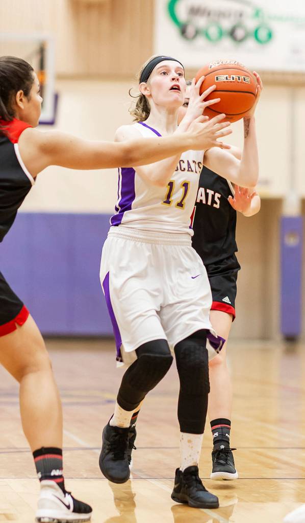 Olivia Waite goes to the hoop for two points.(Photo by John Fisken)