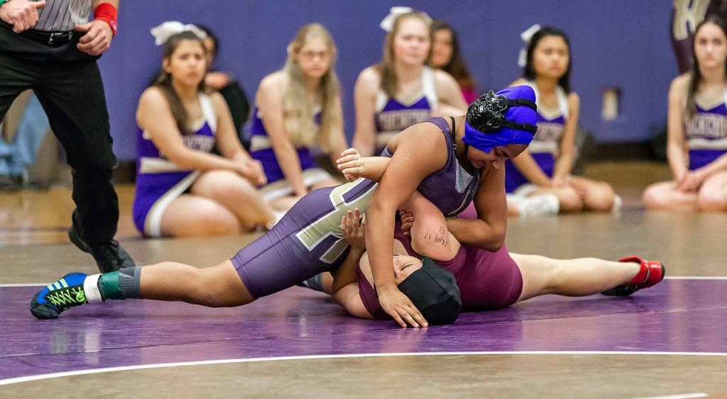 Diandra Dominguez, top, takes control of her match.(Photo by John Fisken)