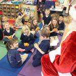 Kiwanis helps Santa deliver oranges, joy to children