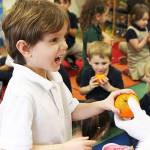 Kiwanis helps Santa deliver oranges, joy to children