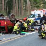 Photo by Jessie Stensland                                Firefighters work to extract the driver of a vehicle involved in a head-on crash.