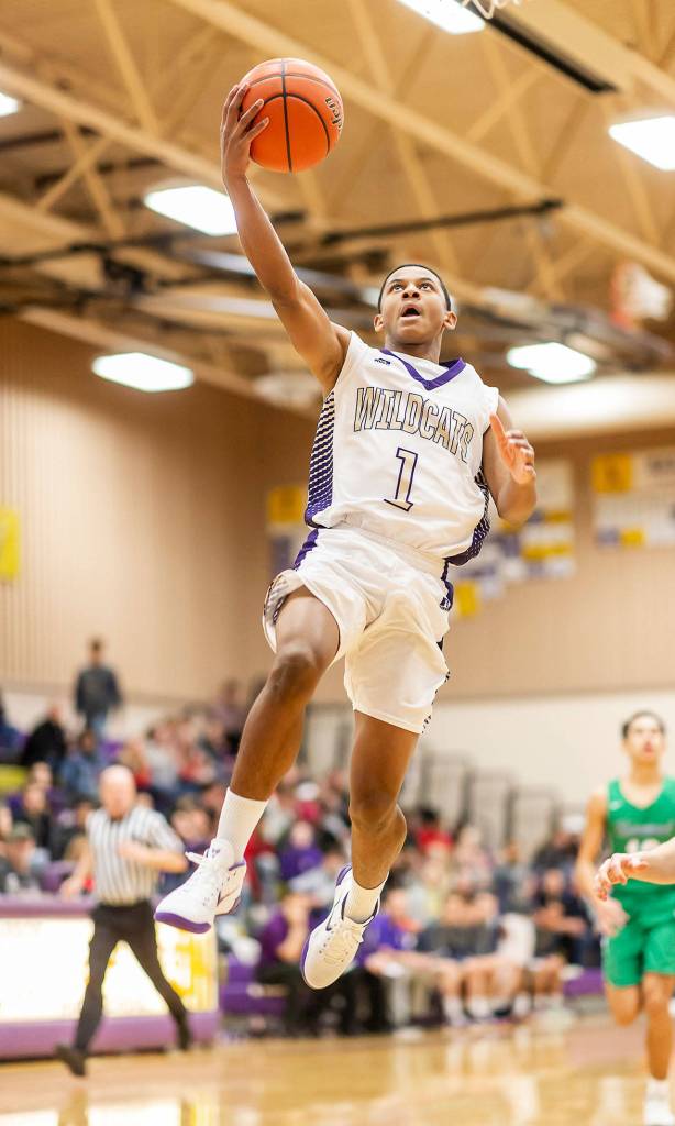 After a steal, Dorian Hardin takes the ball in for a lay-up.(Photo by John Fisken)