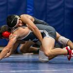 Caleb Fitzgerald, top, tangles with Isaac Ortega of Stanwood in the 132-pound finals.(Photo by John Fisken)