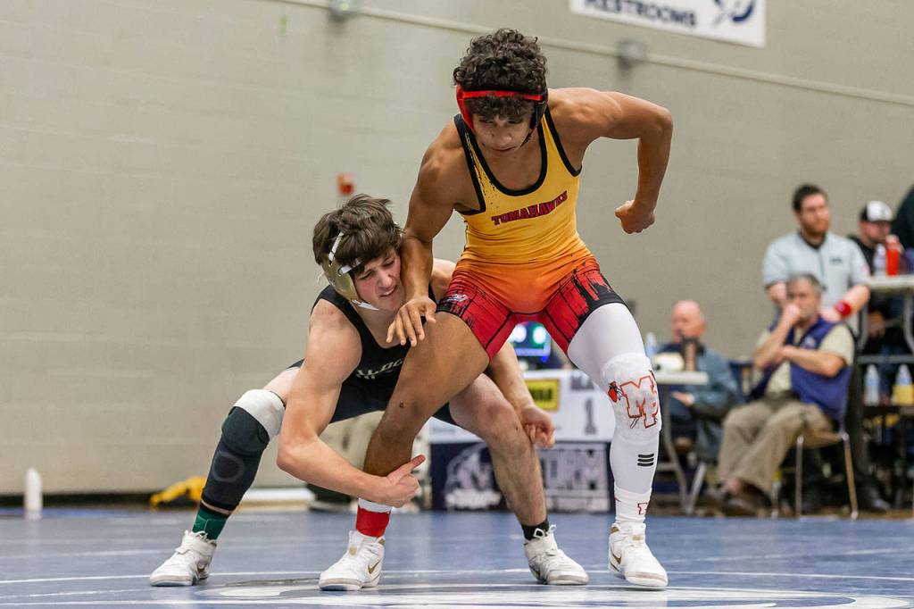 Oak Harbors Blake McBride, left, tries to take down Marysville-Pilchucks Isaiah Galindo in the match for first place.Ian McLean of Decatur