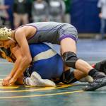 Cole Valdez, top, battles Decaturs Collin Jack in the preliminary rounds at 106 pounds.Ian McLean of Decatur