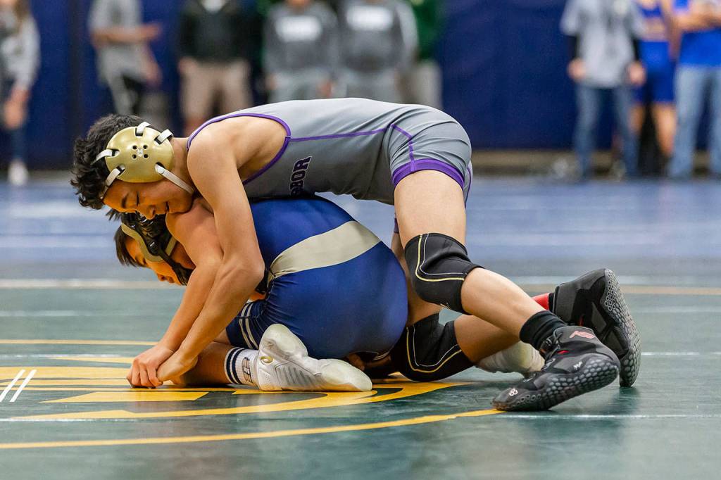 Cole Valdez, top, battles Decaturs Collin Jack in the preliminary rounds at 106 pounds.Ian McLean of Decatur