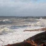 Large swells hit the shore and houses in the Admirals Cove neighborhood Thursday. Roads nearby were flooded after a surge caused water to come ashore. Photo by Laura Guido/Whidbey News-Times