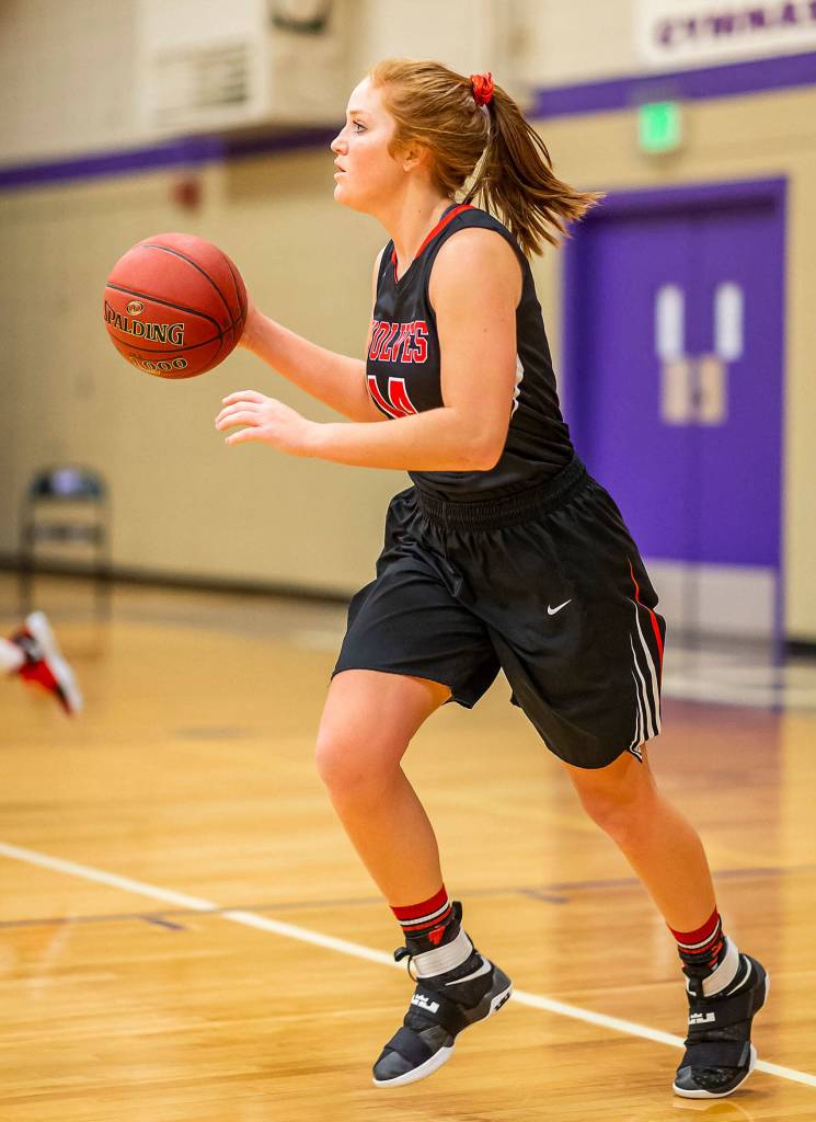 Ema Smith advances the ball for the Wolves. (Photo by John Fisken)
