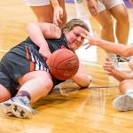Coupevilles Nicole Laxton, left, hits the floor to secure a loose ball.(Photo by John Fisken)