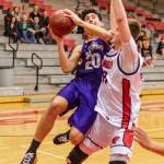 Matt Kelley powers to the hoop against Bellingham.(Photo by John Fisken)