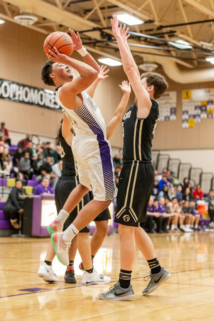 Gavin Allen shoots over a Lynnwood defender Friday.(Photo by John Fisken)