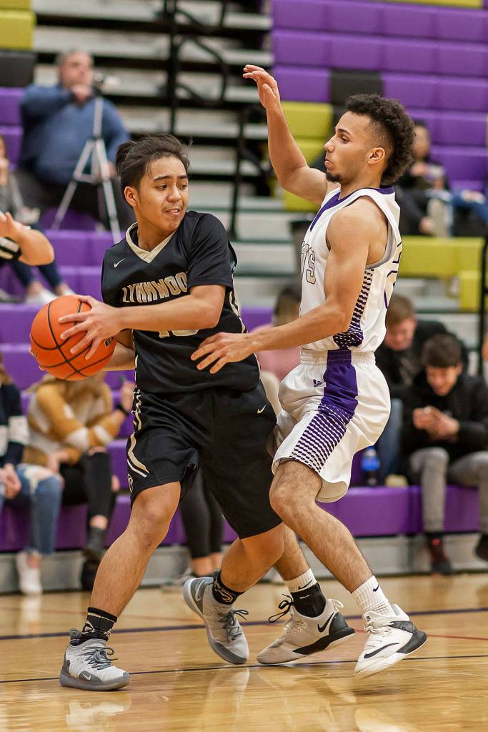 Haven Brown, right, clamps down a Lynnwood player.(Photo by John Fisken)
