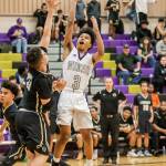 Terrell Crumpton takes the ball to the hole in the Lynnwood game.(Photo by John Fisken)