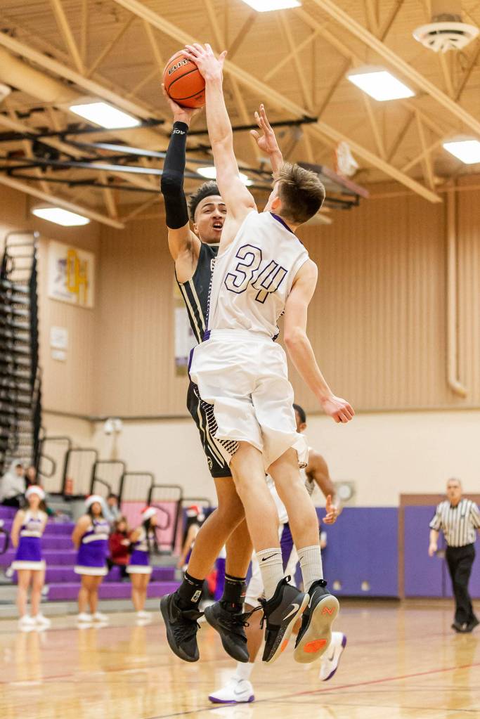 Oak Harbors Kevin Schuldt (34) blocks a Lynnwood shot.(Photo by John Fisken)