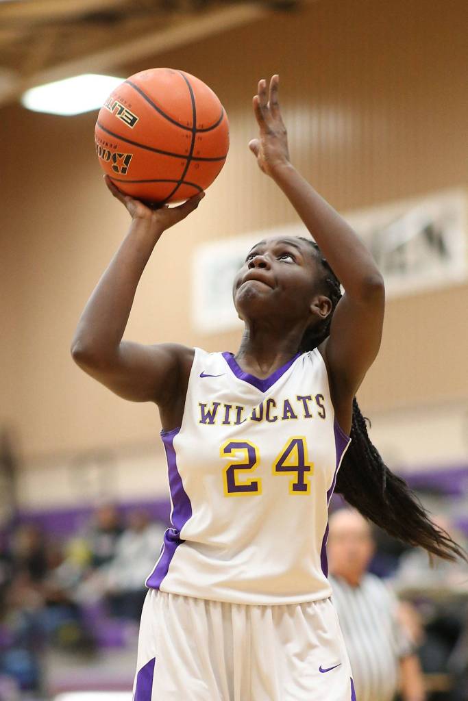 Sarah Mensah puts a shot in Oak Harbors win against Cascade.(Photo by John Fisken)