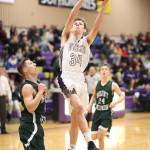 Kevin Schuldt scores 2 of his 7 first-quarter points against Mount Vernon Friday.(Photo by John Fisken)