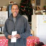 Photo by Laura Guido/Whidbey News-Times                                James Parham accepts his check after successfully reciting Hamlets fourth soliloquy from memory for the Hamlet Challenge at Spin Cafe.