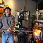 Callahan McVay makes a sea float in his Firehouse Studio and Gallery in Langley. Hes made thousands of small glass orbs over the years for the annual Langley Sea Float Scramble, which takes place Saturday. Photo by Patricia Guthrie/Whidbey News Group