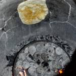 Naan cooks in a clay tandoori oven, a staple of northern Indian food.