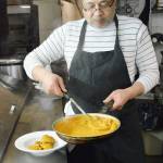 Jaspal Dhillon plates a dish of butter chicken at Harbor View Tasty India. Dhillon has decades of experience as a chef of Indian cuisine.