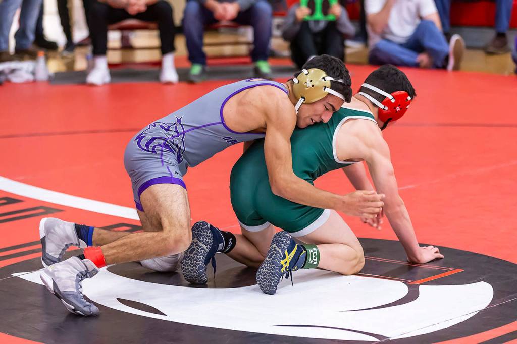 Caleb Fitzgerald, left, tries to break down Edmonds-Woodways Alexander Papelje.(Photo by John Fisken)