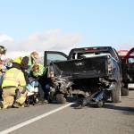 First responders help a woman who was driving a pick-up involved in an accident Monday afternoon. She and the passenger in the other vehicle were both transported to WhidbeyHealth Medical Center for unknown injuries. Photo by Laura Guido/Whidbey News-Times