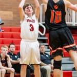 Mason Grove fires up a three-ball in Tuesdays game. Grove hit four from long range in the Wolves win.(Photo by John Fisken)
