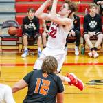 Gavin Knoblich flies toward the rim for the Wolves.(Photo by John Fisken)
