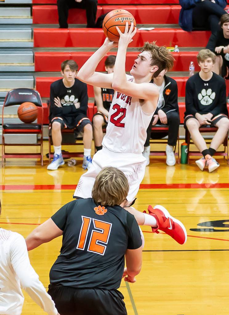 Gavin Knoblich flies toward the rim for the Wolves.(Photo by John Fisken)