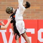 Jacobi Pilgrim leaps for a rebound. (Photo by John Fisken)