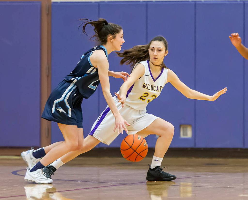 Emily Gouge (23) plays defense for Oak Harbor.(Photo by John Fisken)
