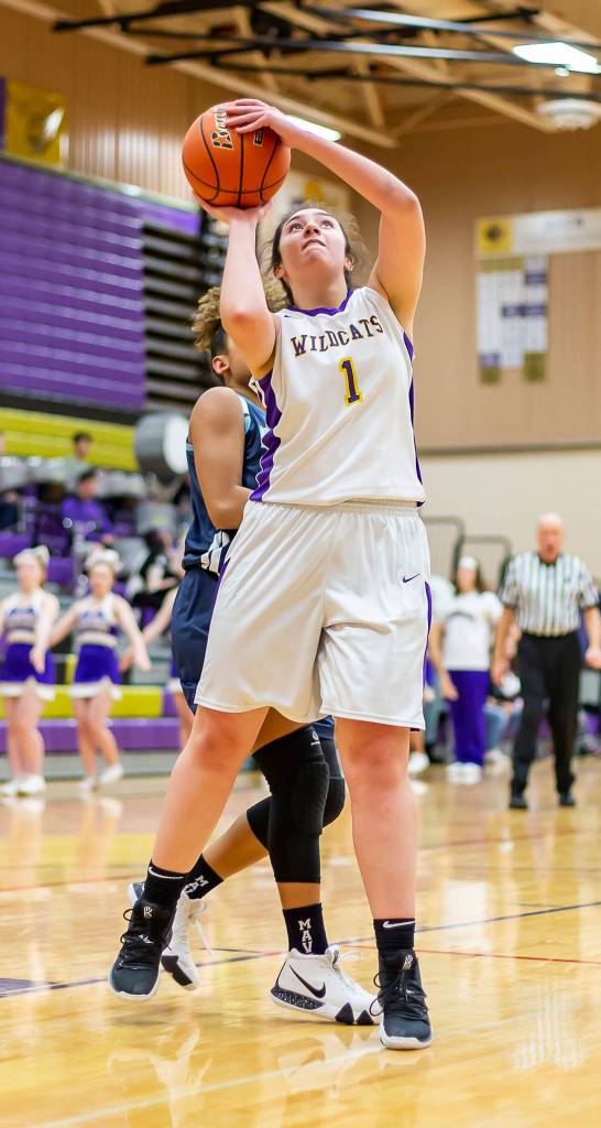 Anna Jones shoots for Oak Harbor in Tuesdays game with Meadowdale.(Photo by John Fisken)