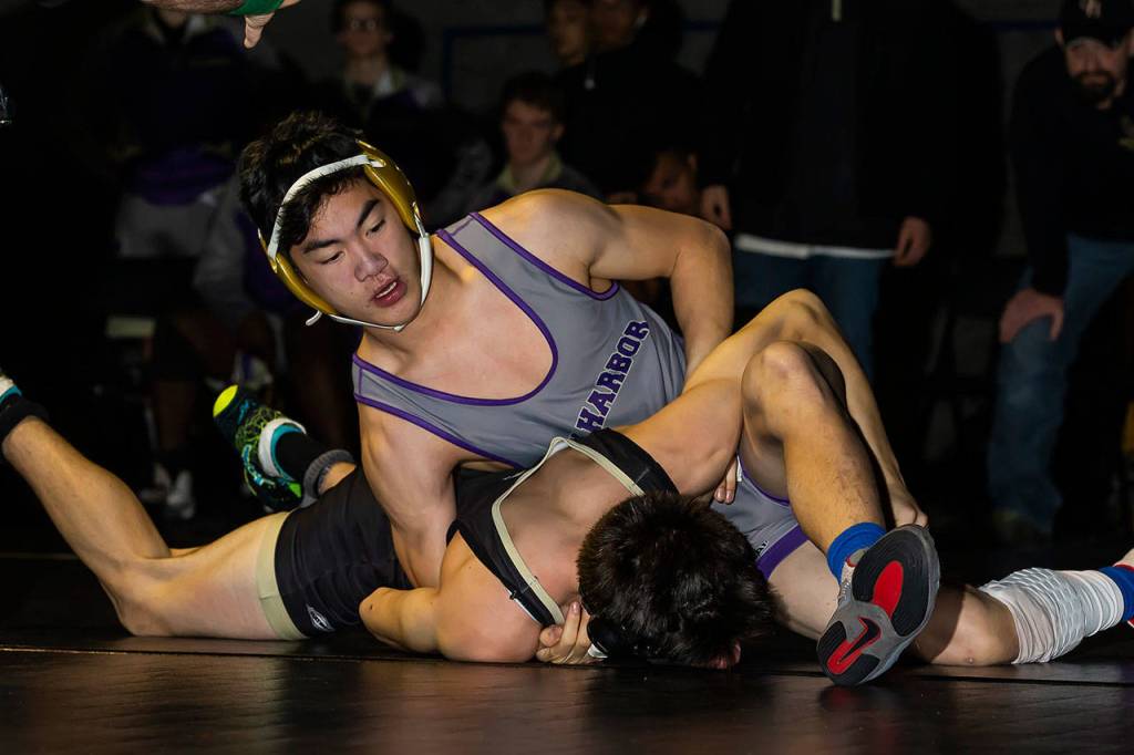 Jakob Dailey, top, works to pin Getchells Taylor Herridge.(Photo by John Fisken)