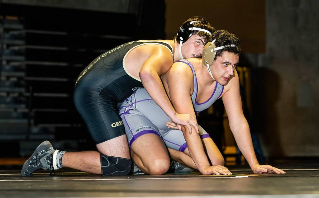 Salvador Tirado, bottom, gets ready to start a round with MGs Caleb Blonk.(Photo by John Fisken)