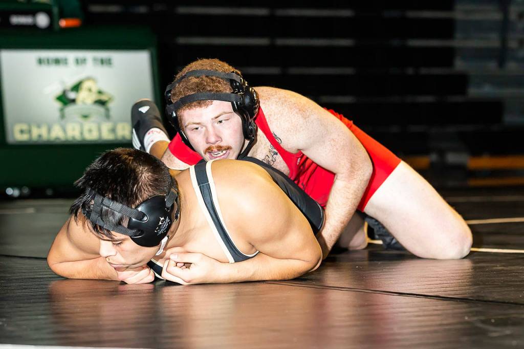 Coupevilles Alex Turner, top, wrestles with Edgar Duenas.(Photo by John Fisken)