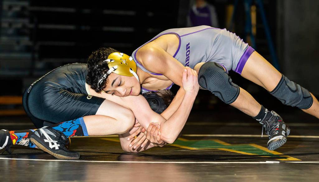 Cole Valdez, right, works to control Getchells Jacob Steele.(Photo by John Fisken)