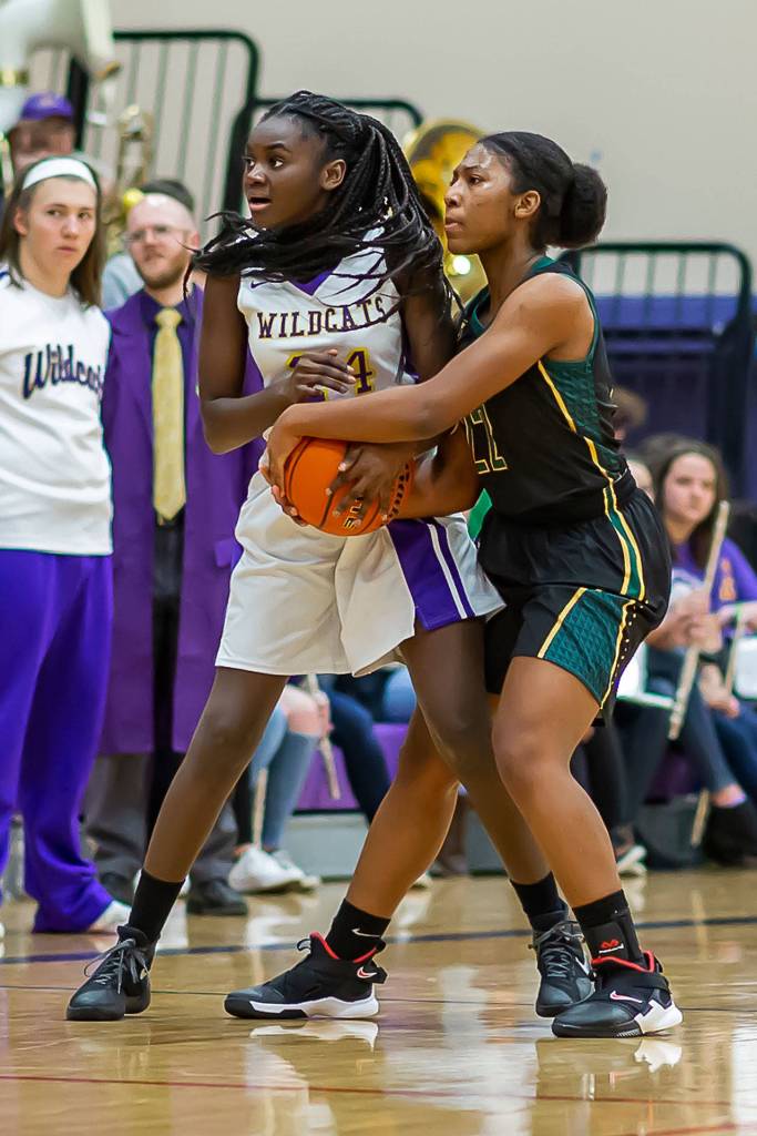Oak Harbors Sarah Mensah, left, and Shorecrests Amanda Kagarabi look to the official for the call.(Photo by John Fisken)