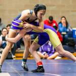 Oak Harbors Anika Rasmussen, right, takes on Arlingtons Kate Rossen.(Photo by John Fisken)