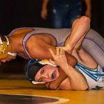 Brandon Liberty, top, tries to turn Mariners Spencer Sliss. (Photo by John Fisken)