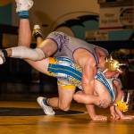 Blake McBride, top, goes for a ride with Mariners Ryan Fry.(Photo by John Fisken)