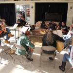The Johnson family participates in a weekly acoustic jam session at Click Music in Oak Harbor.                                 (Photo by Maria Matson/ Whidbey News-Times)