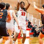 JaKenya Hoskins (33) looks for an open teammate.(Photo by John Fisken)