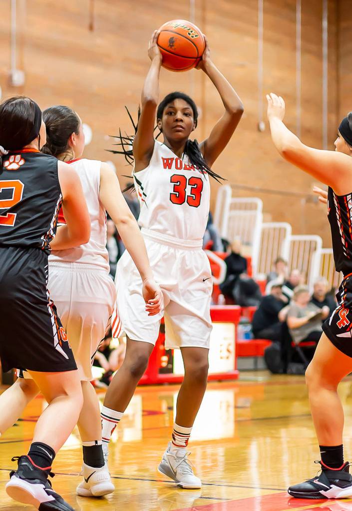 JaKenya Hoskins (33) looks for an open teammate.(Photo by John Fisken)