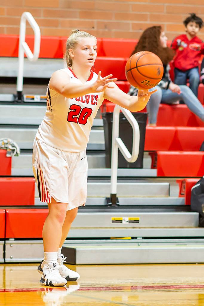 Avalon Renninger puts the ball in play with an inbounds pass.(Photo by John Fisken)