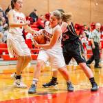 Tia Wurzrainer rips the ball from Granite Falls Jennifer Rodenbaugh.(Photo by John Fisken)
