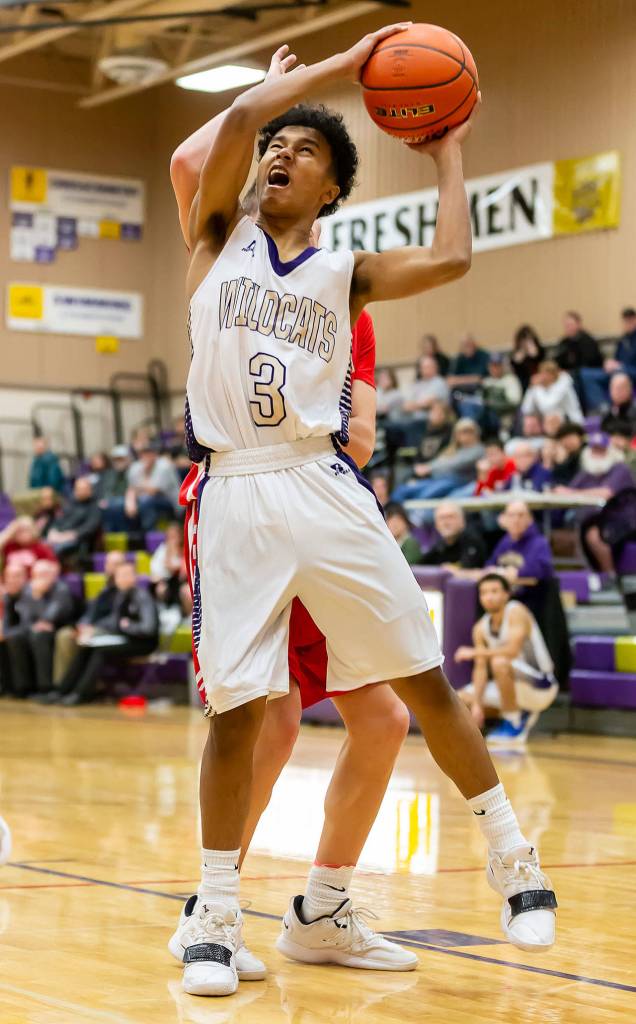 Terrell Crumpton attack the hoop for Oak Harbor.(Photo by John Fisken)